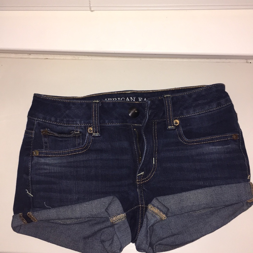 Dark wash jean shorts.